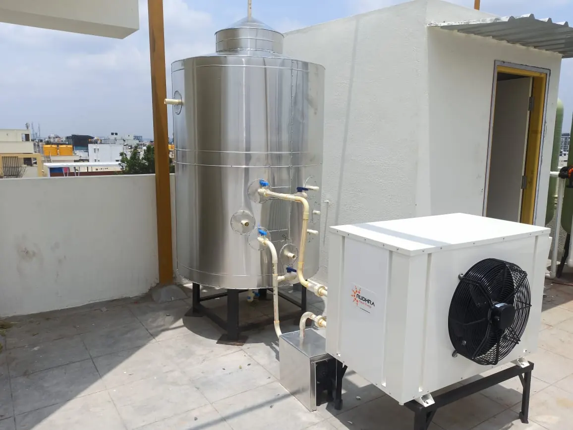 Rudhra heat pump with stainless steel hot-water tank on a terrace