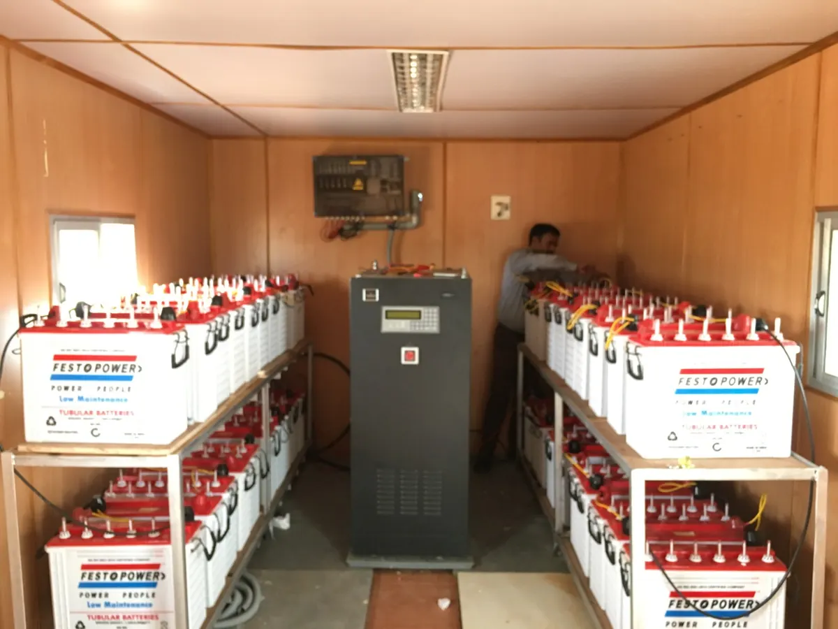 Off-grid battery room with inverter and tubular battery bank