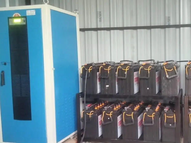 Off-grid inverter cabinet beside a battery bank