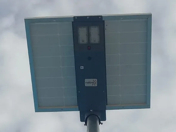 Rudhra all-in-one solar street light on its pole, seen from below