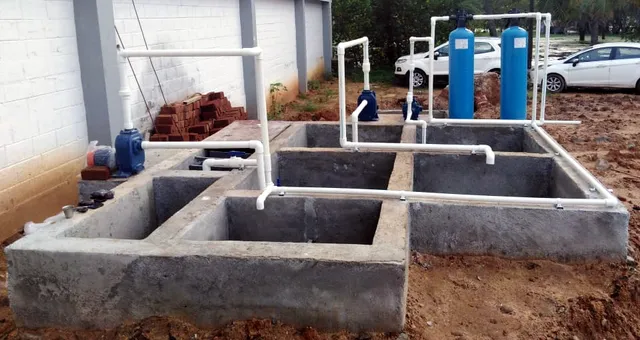 Civil STP tank chambers with pumps, pipework and two blue filters