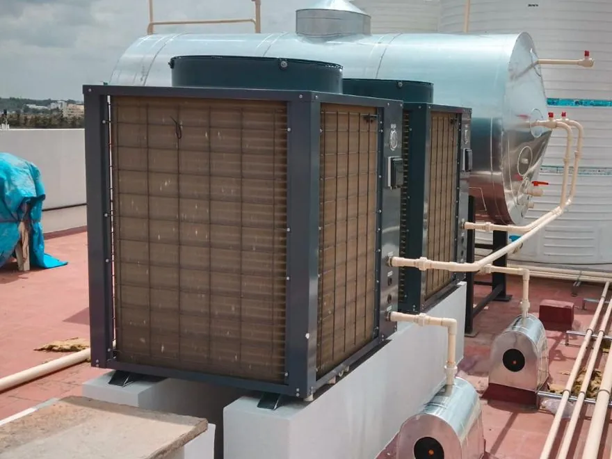 Two commercial heat pumps paired with a Rudhra Solar horizontal storage tank